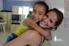Christina Phillips, SIS/MA '12, and a friend at her internship with <i>Projeto Criança Feliz</i>, or the Happy Child Project, in Brazil.